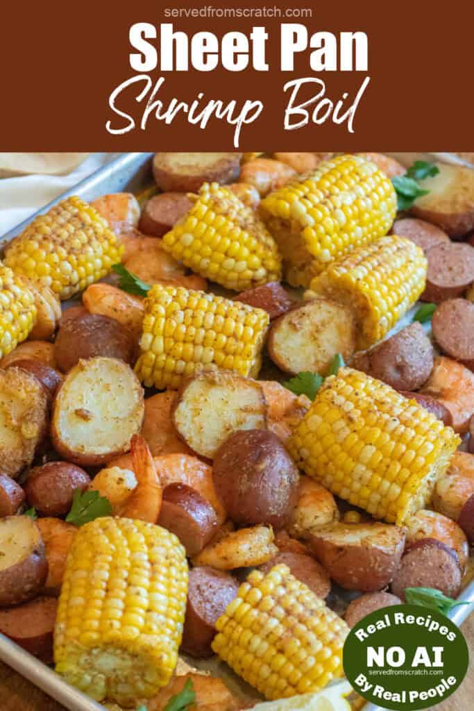 an overhead of a sheet pan with cooked corn on the cob pieces, shrimp, and potatoes with Pinterest pin text and NO AI sticker.