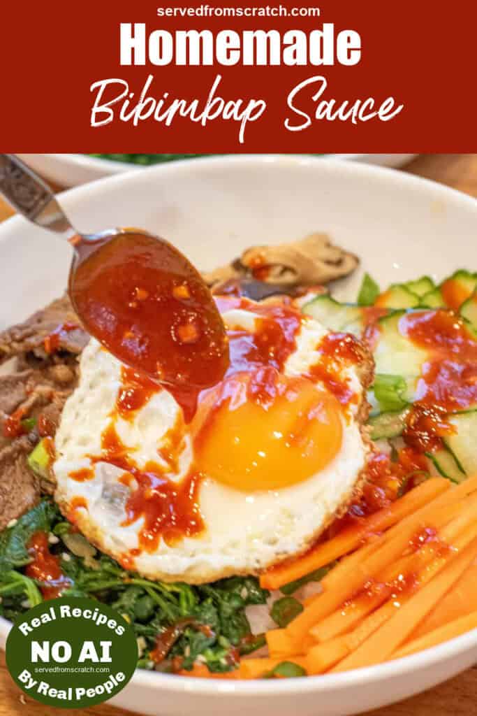 bibimbap sauce being spooned onto a fried egg in a bowl of bibimbap with NO AI sticker and Pinterest pin text.