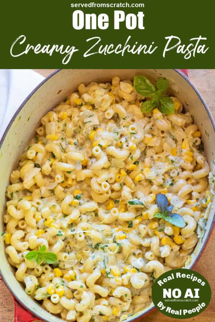 an overhead of a dutch oven with cooked pasta and creamy cheese and fresh basil with PInterest pin text and NO AI sticker.