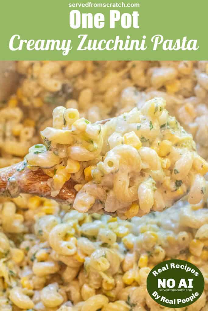 an overhead of a dutch oven with cooked pasta and creamy cheese and a wooden spoon with a creamy scoop with Pinterest pin text and NO AI sticker.