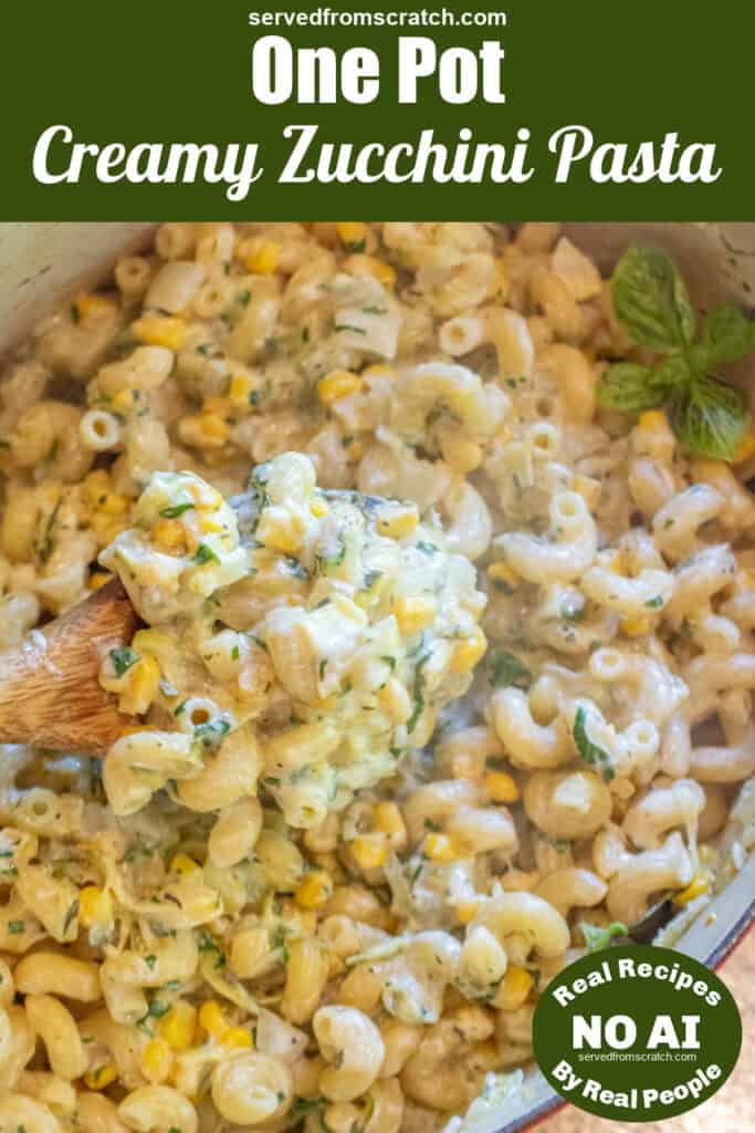 an overhead of a dutch oven with cooked pasta and creamy cheese and a wooden spoon with a creamy scoop with Pinterest pin text and NO AI sticker.