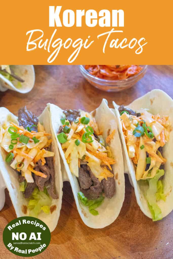 an overhead of 3 tacos in a taco holder with beef, slaw, and green onions on top with Pinterest pin text and NO AI sticker.