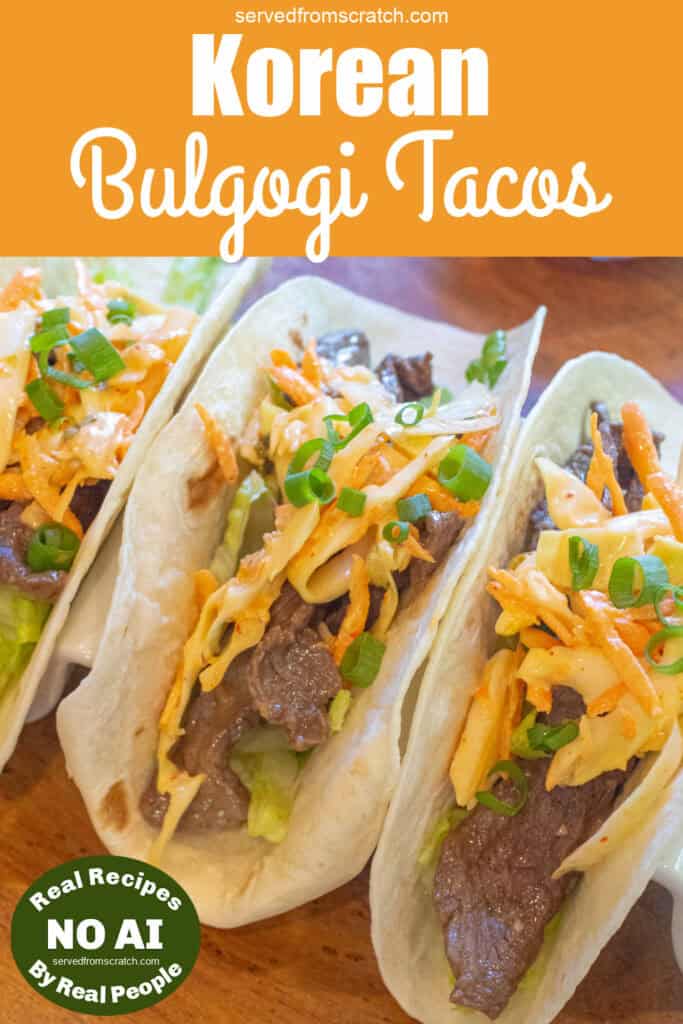 an overhead of 3 tacos in a taco holder with beef, slaw, and green onions on top with Pinterest pin text and NO AI sticker.