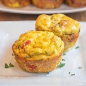 two baked egg cups on a plate.
