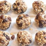 a plate of oat balls with raisins.