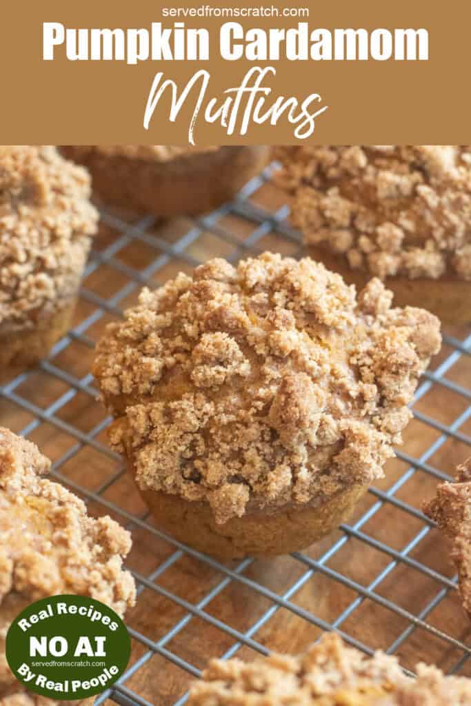 a cooling rack of muffins with a crumble topping with Pinterest pin text and NO AI sticker.