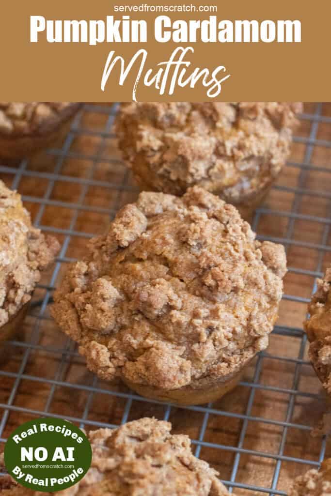 a cooling rack of muffins with a crumble topping with Pinterest pin text and NO AI sticker.